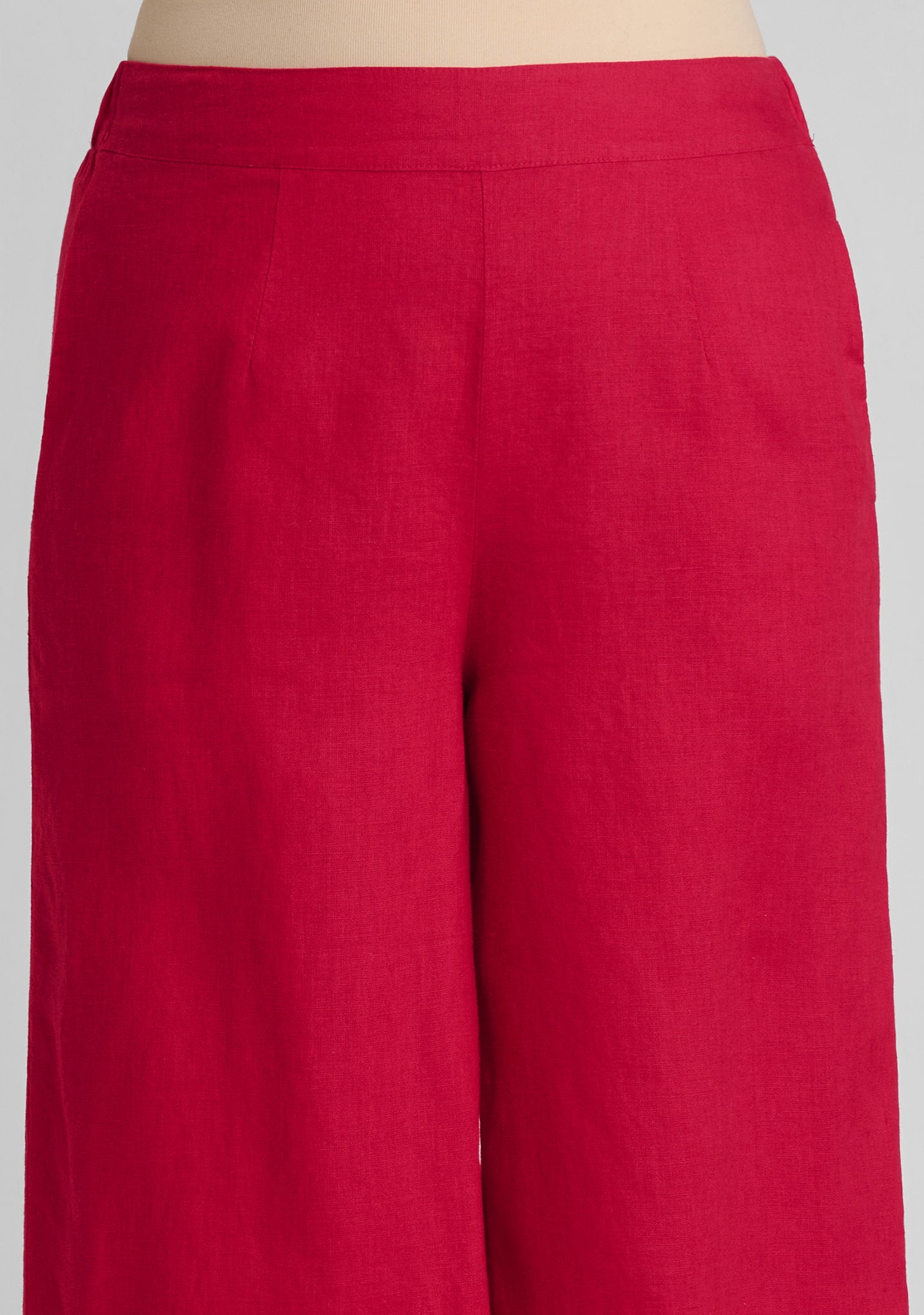 flat front waistband and pleat detail of women's linen pants in red
