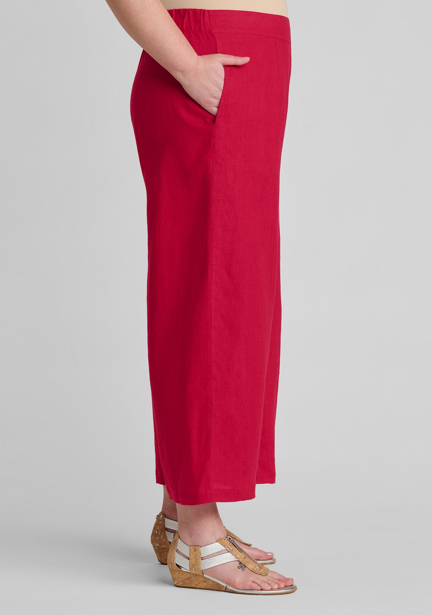 side view of women's linen pants in red with hand in pocket