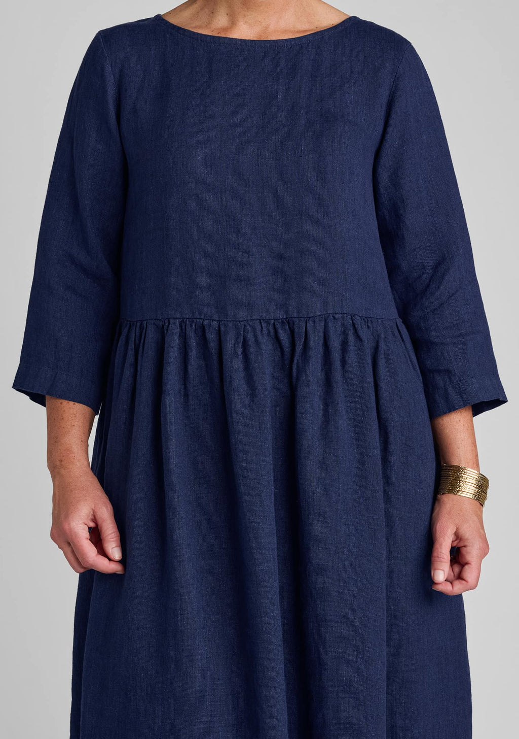 close up view of details on blue linen dress
