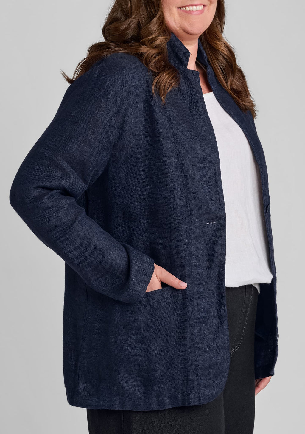 side view of pocket on womens linen blazer in blue