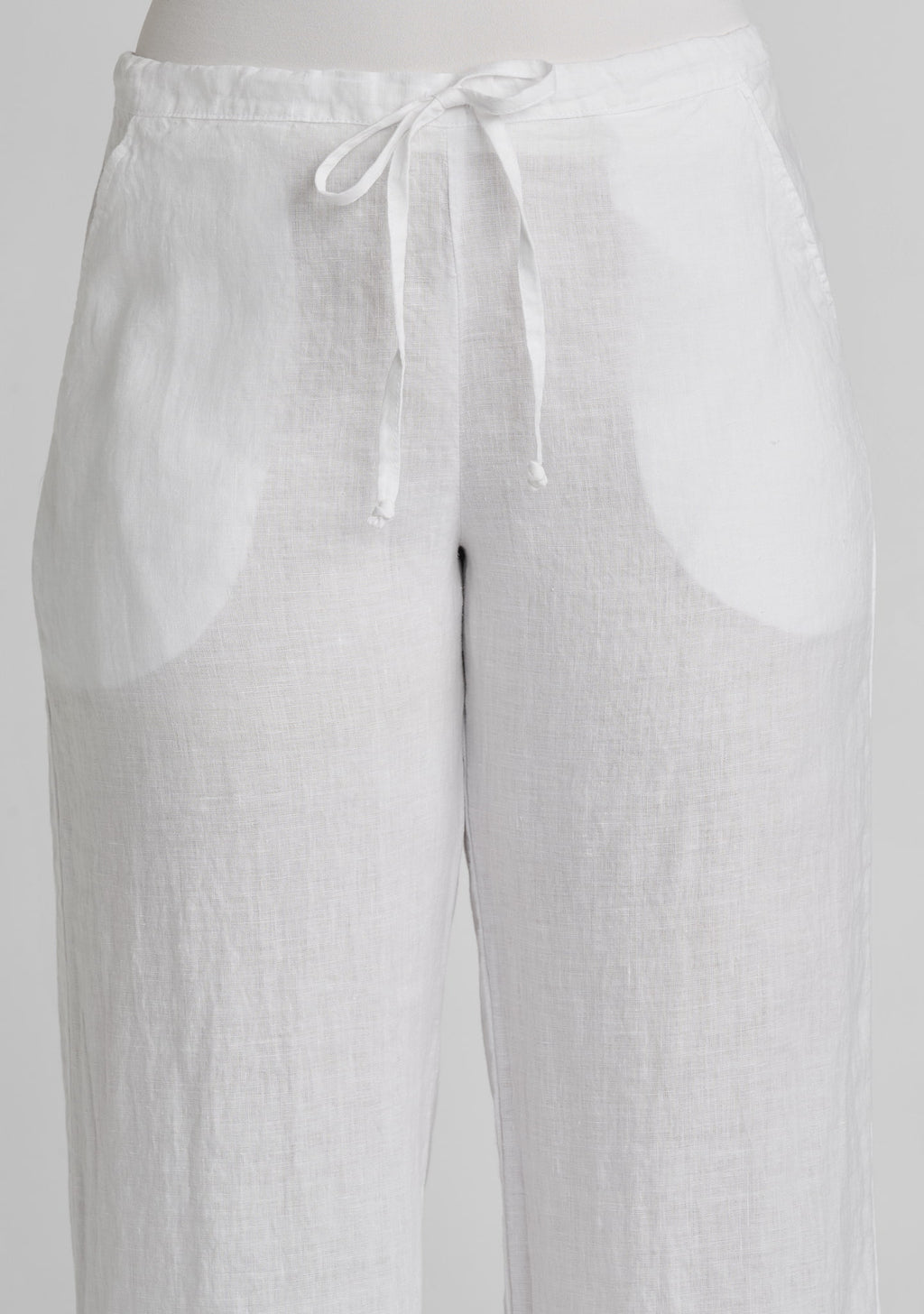 waistband and drawstring of white linen pants