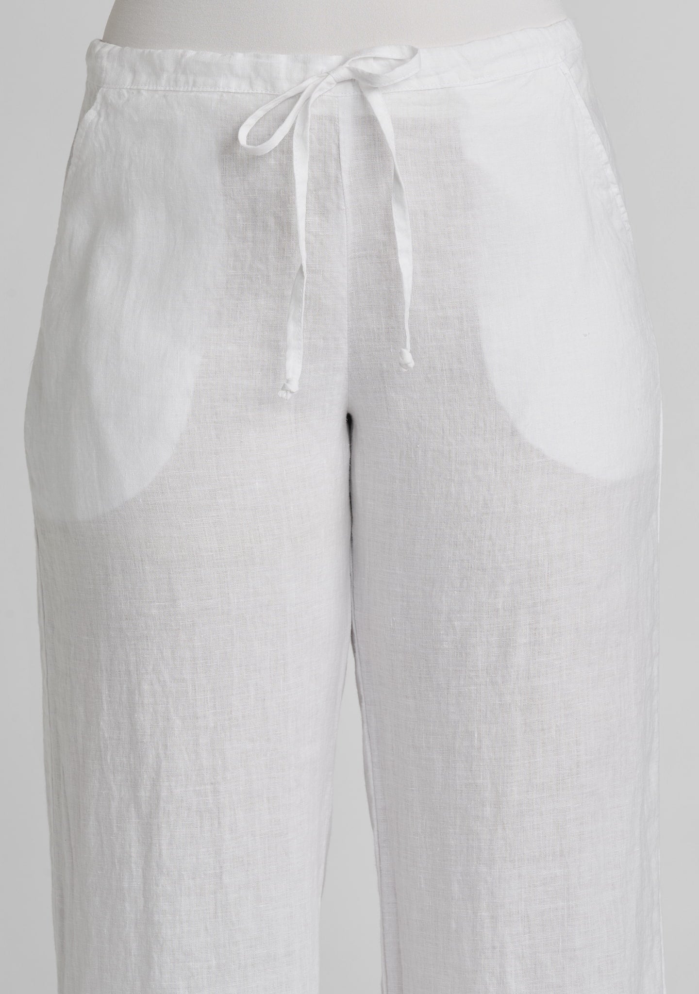 waistband and drawstring of white linen pants