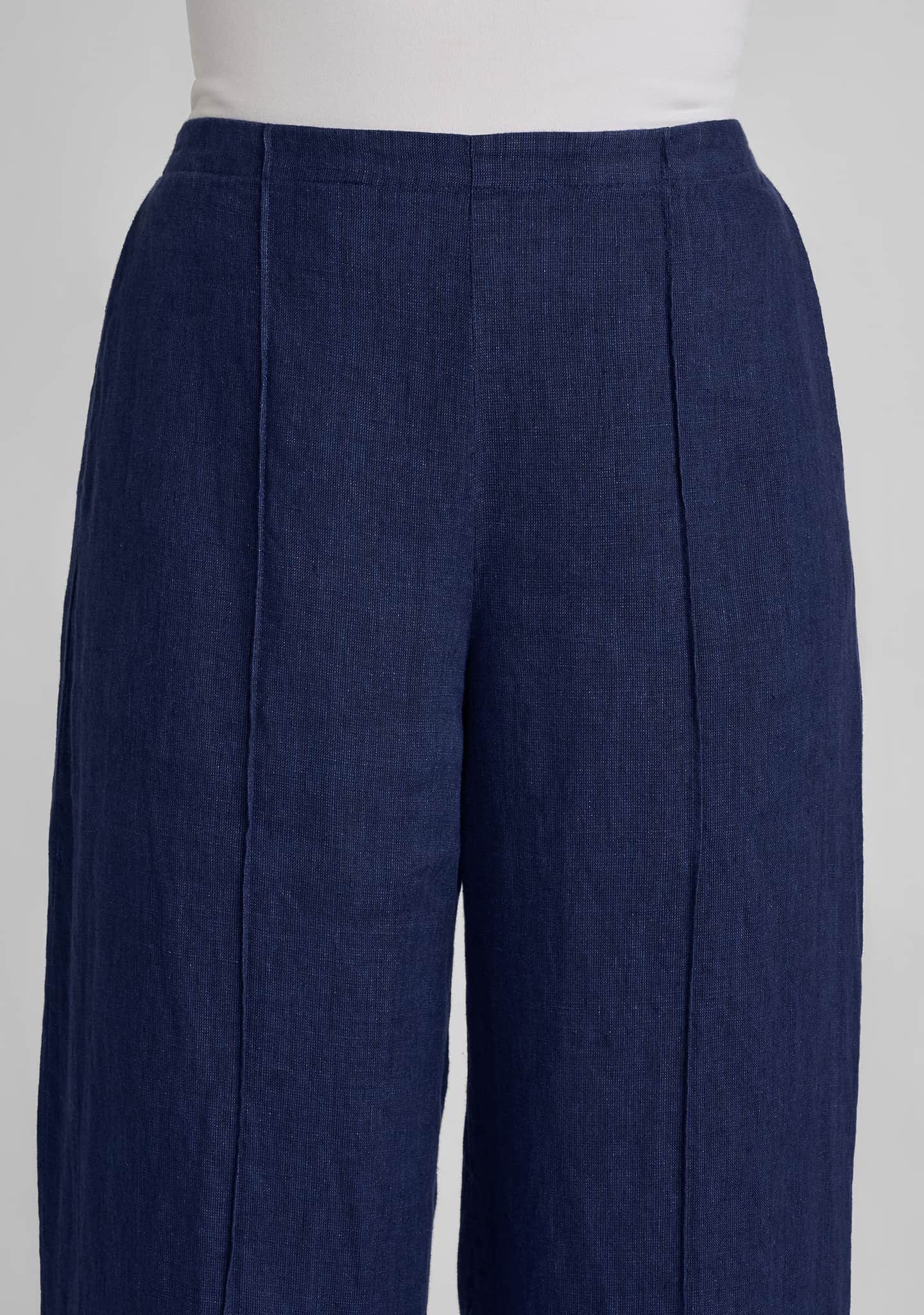 close up view of pintuck details and flat front waist on pant