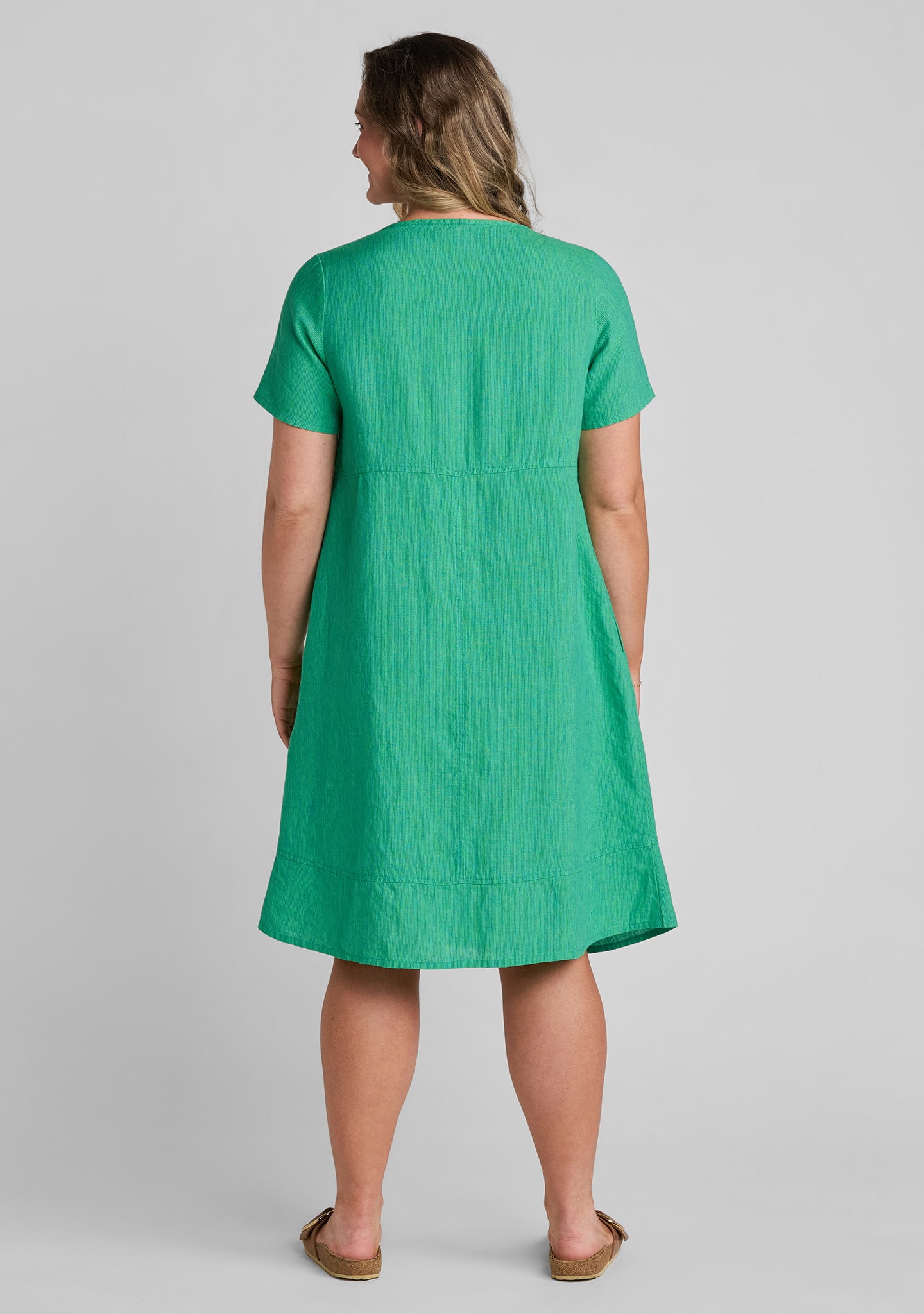 back view of women's linen dress in green