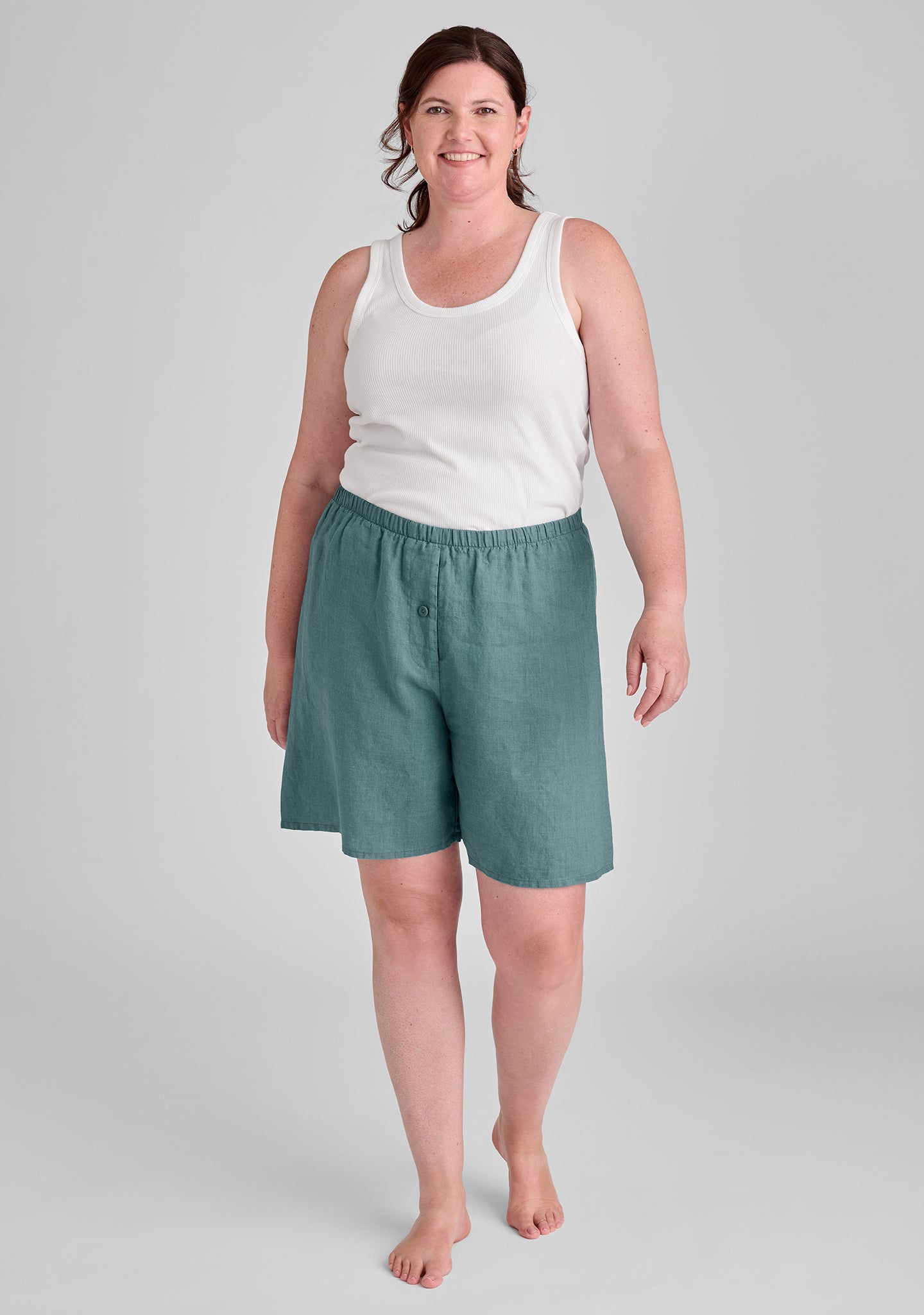 FLAX linen shorts in green with white tank top