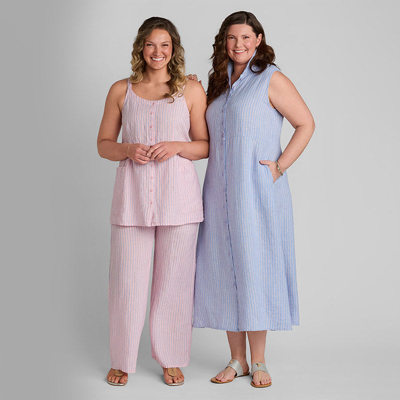 Woman in pink linen tank top and pink linen pants and another woman in a sleeveless blue linen dress with pockets