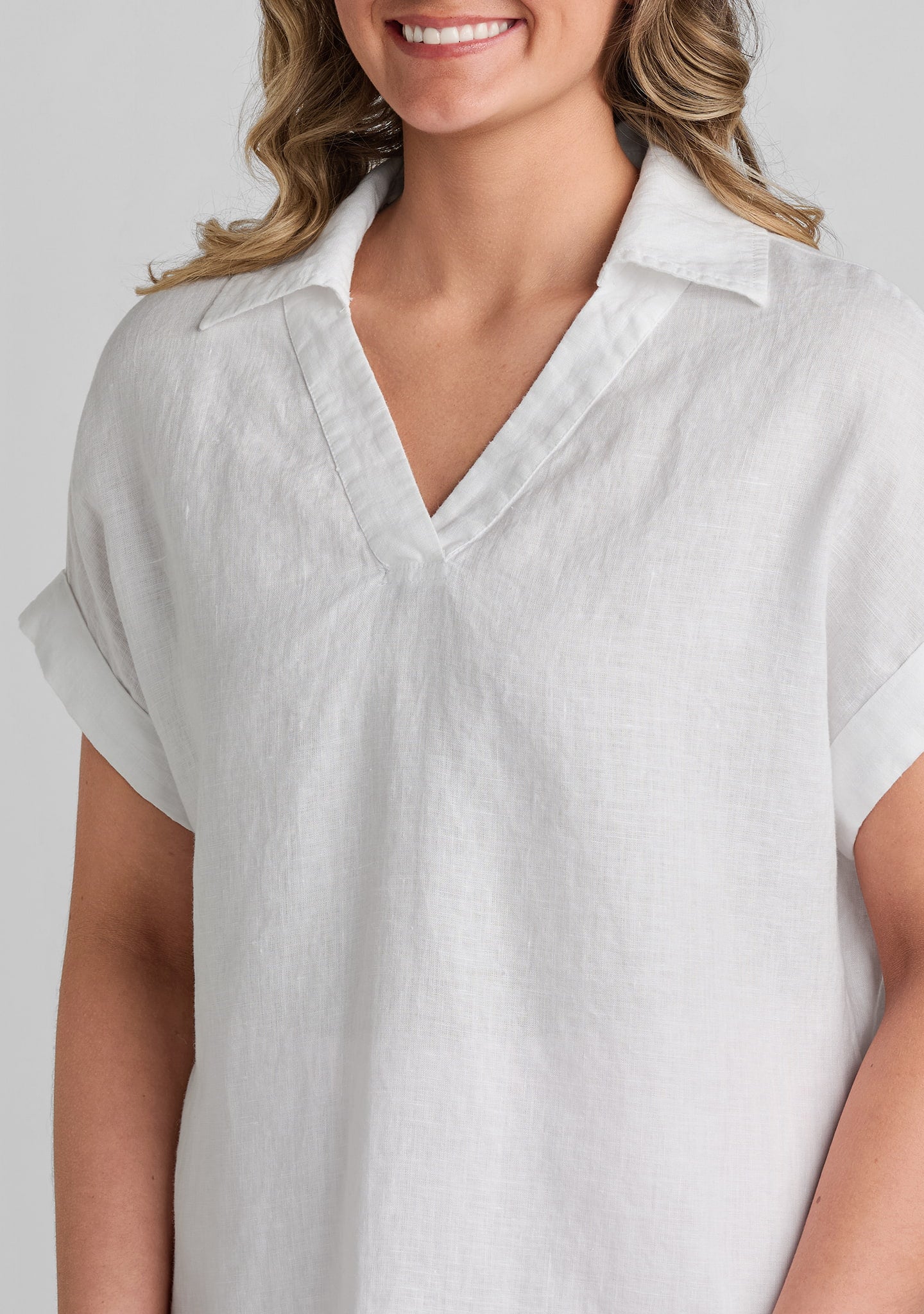 close up of neckline and collar on white linen shirt