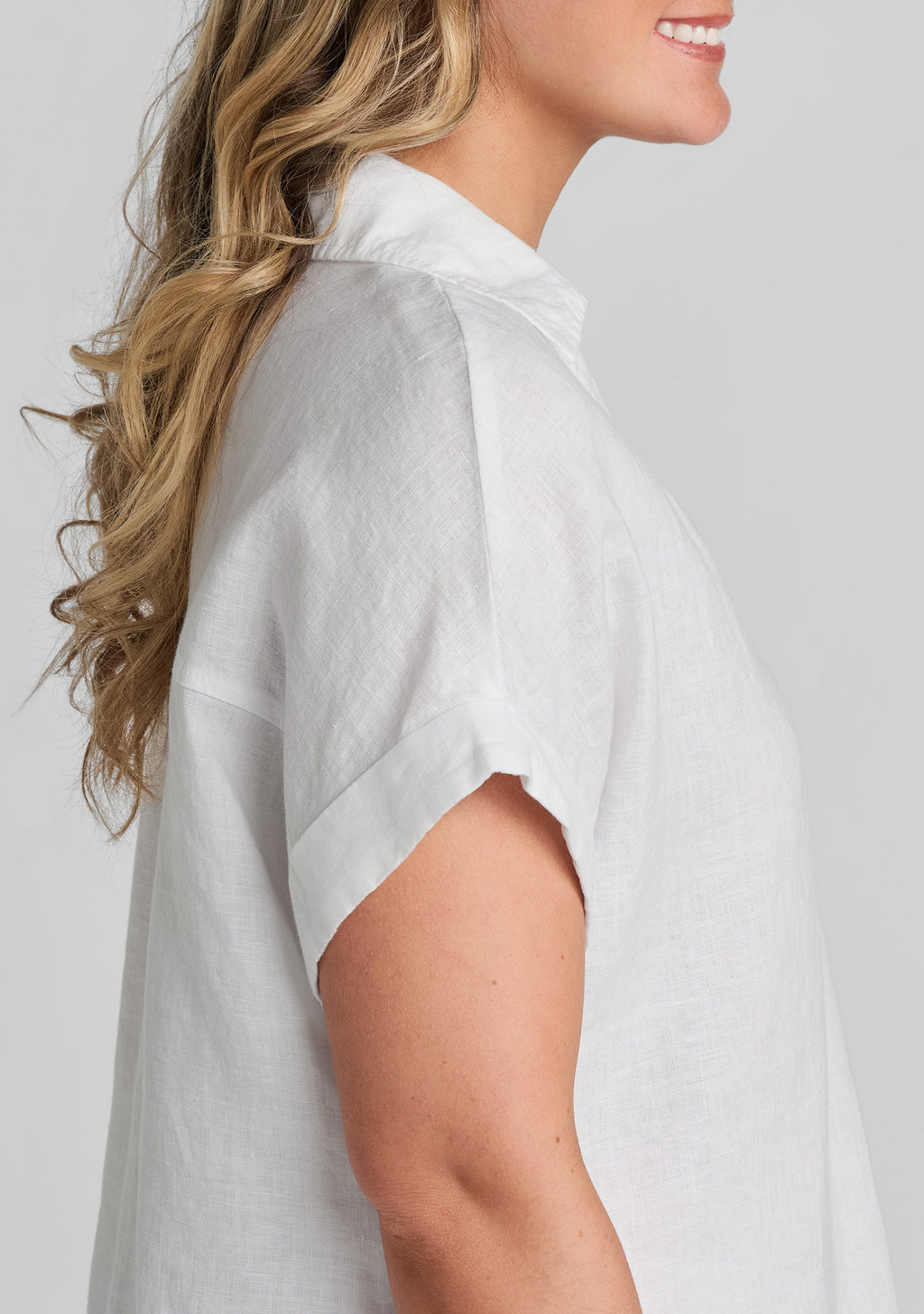 side view of sleeve on white linen shirt