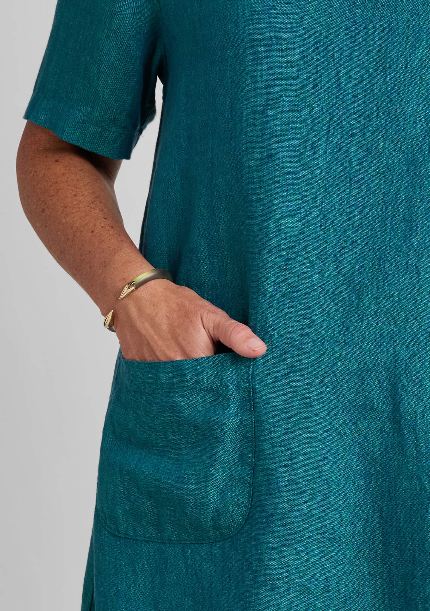 pocket details on a green linen t shirt