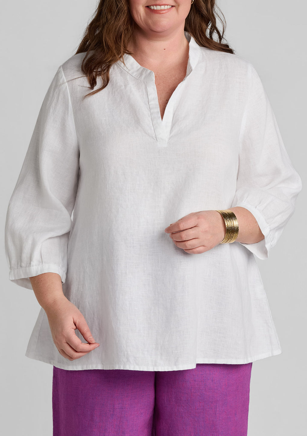 front view of details on sleeve and collar for women's white linen shirt