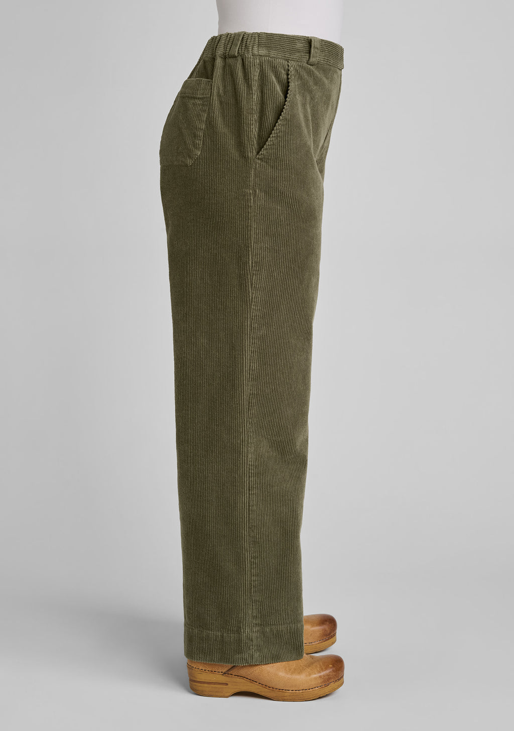 side view of corduroy trousers in green