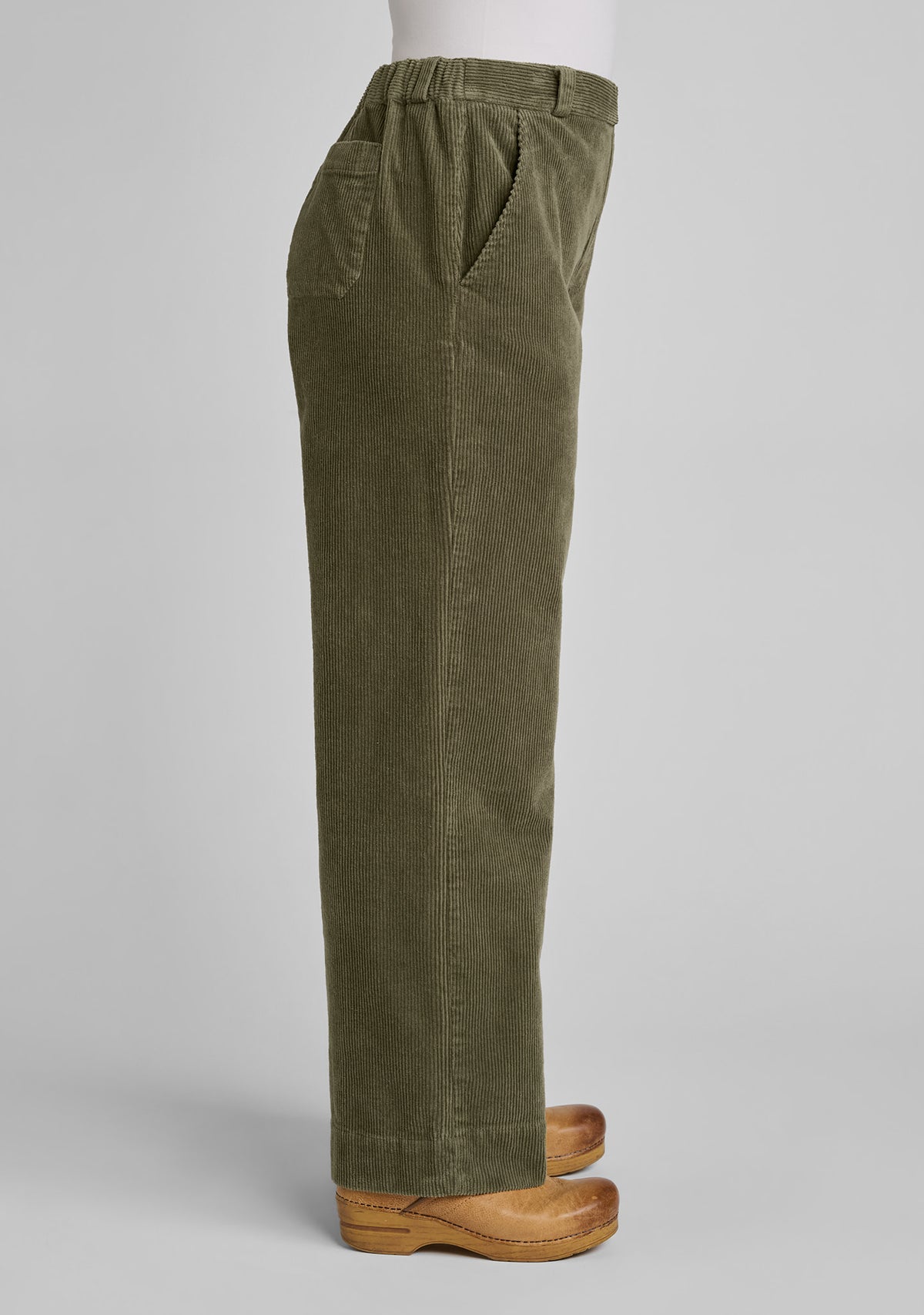 side view of corduroy trousers in green