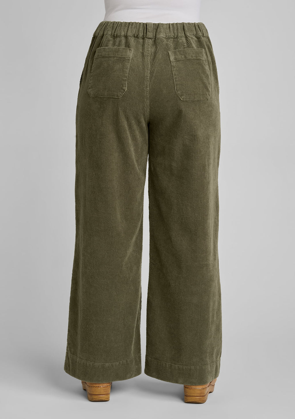 full back view of corduroy trousers in green