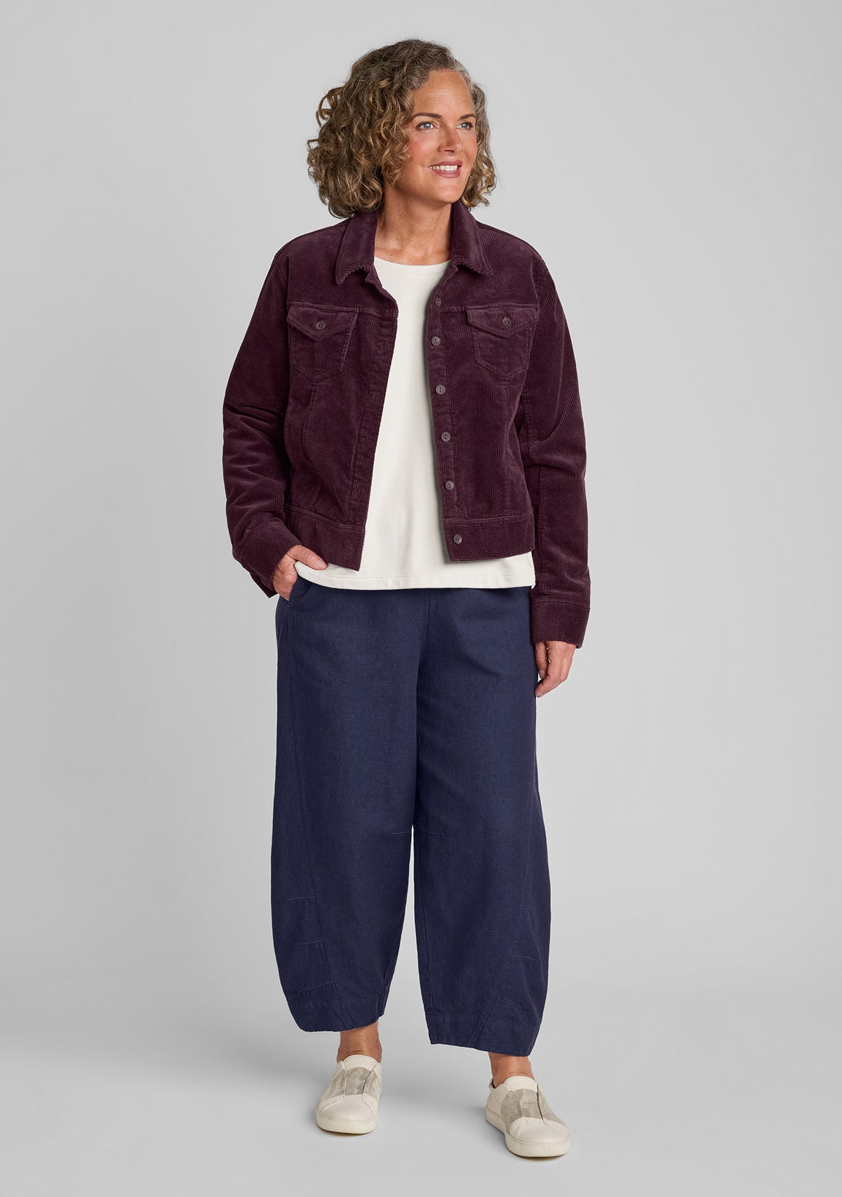 cotton blend corduroy jacket in purple with long sleeve shirt in white and denim pants in blue