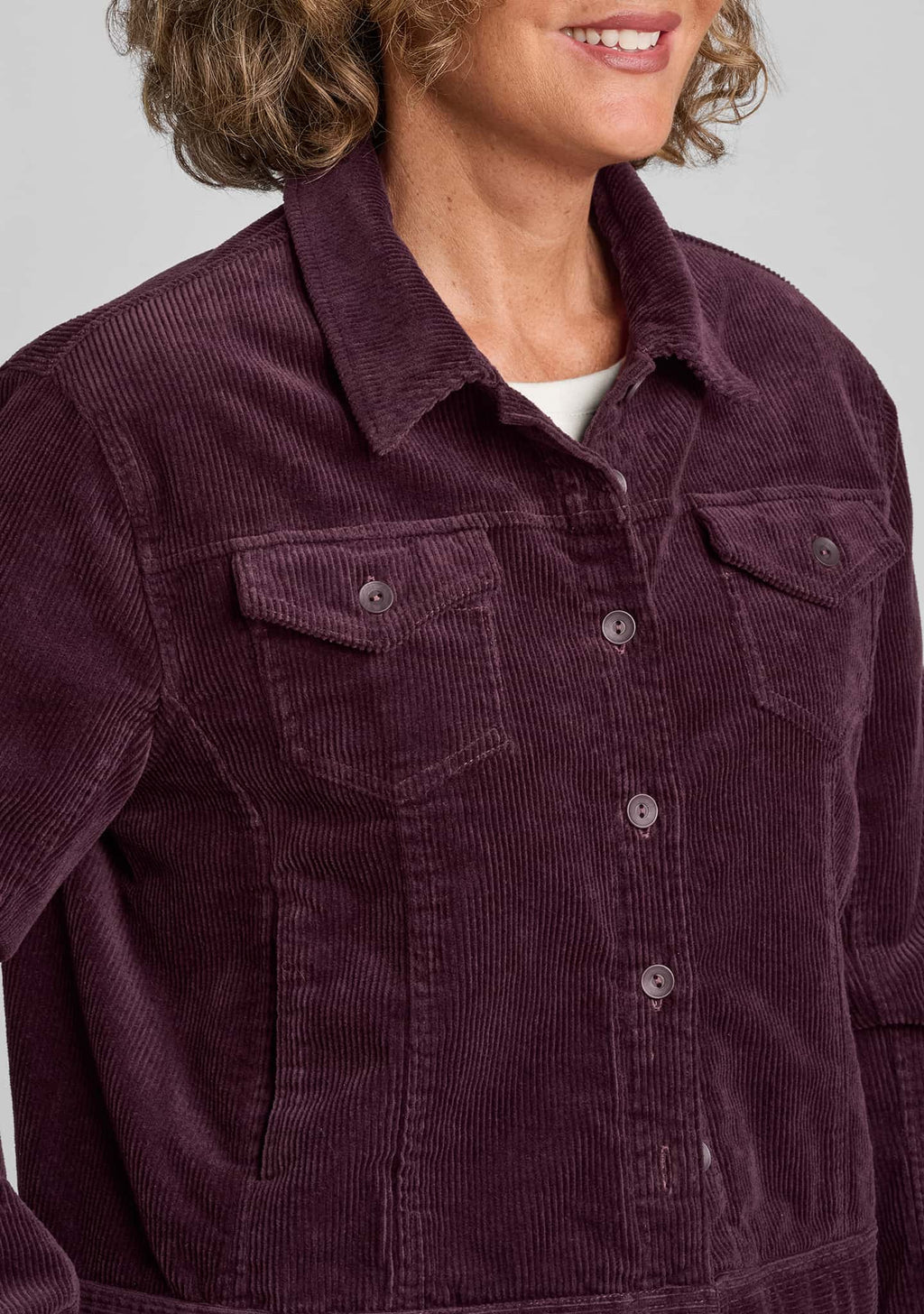 close up of corduroy fabric in purple