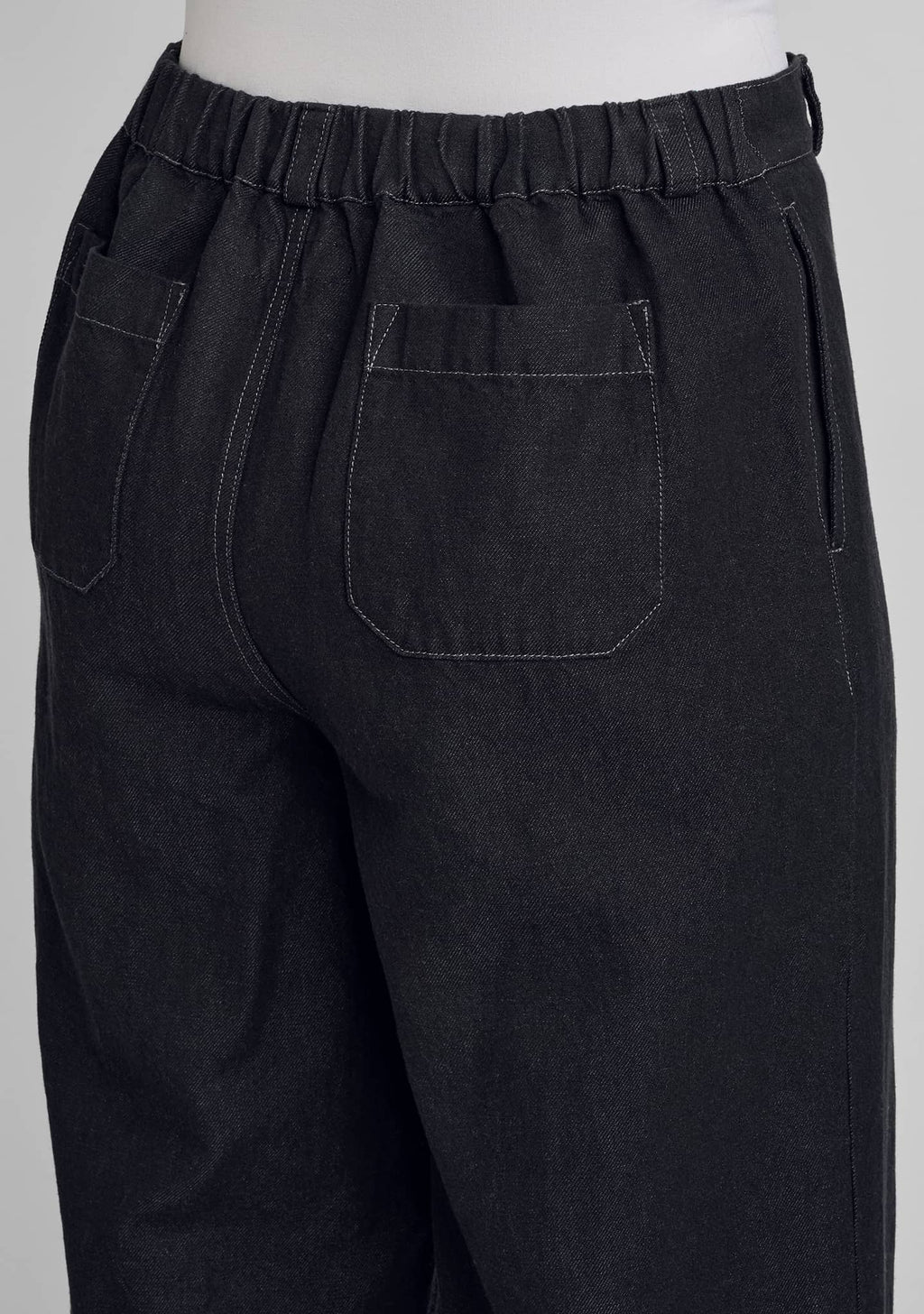 close up view of two pack pockets and waistband
